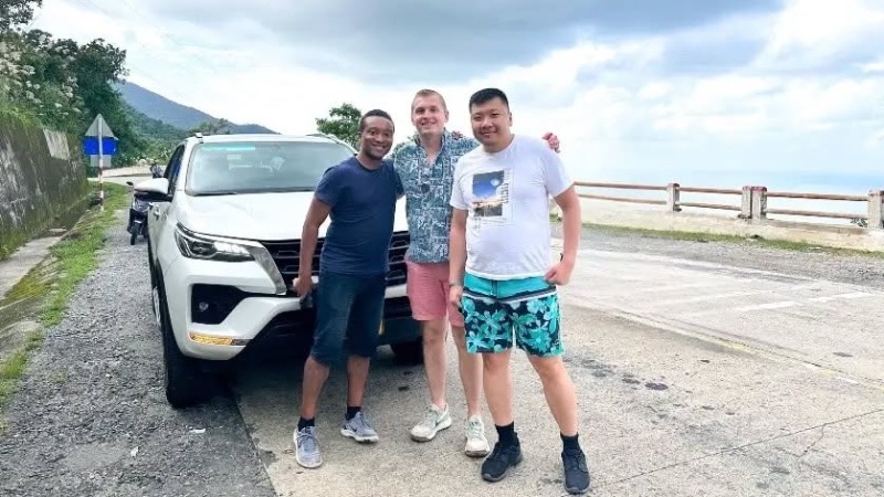 Hoi An to Nha Trang private car transfer with a comfortable vehicle traveling through the scenic landscapes of Central Vietnam.